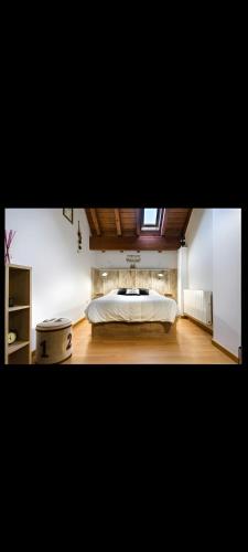 a bedroom with a large bed in a room at Casa Palacin in Guasillo