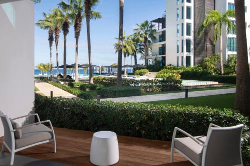 a view of the beach from the balcony of a resort at The Ocean Club, a Luxury Collection Resort, Costa Norte in Sosúa
