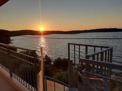 a sunset over a body of water at ARTE MARE d'Irene in Spárton
