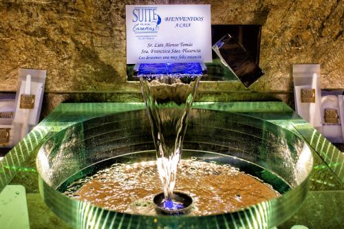 a water fountain in a store with a sign at Suite Rural Carenas in Carenas