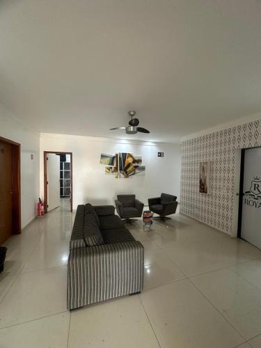 a large living room with a couch and chairs at Royal Hotel e Gastronomia Macapá in Macapá