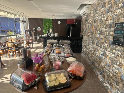 a buffet line with food on a table in a restaurant at Royal Hotel e Gastronomia Macapá in Macapá