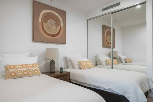Ένα ή περισσότερα κρεβάτια σε δωμάτιο στο Lux Lakeside Apt - Gold Coast