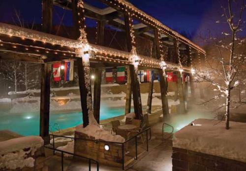 a resort with a swimming pool with christmas lights at Marriott Summit Watch 1BD in Park City