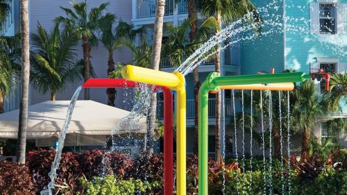 a water slide in a park with a fountain at Beautiful resort 1BD condo with amazing resort amenities pool, kiddie pool, and more in Nassau