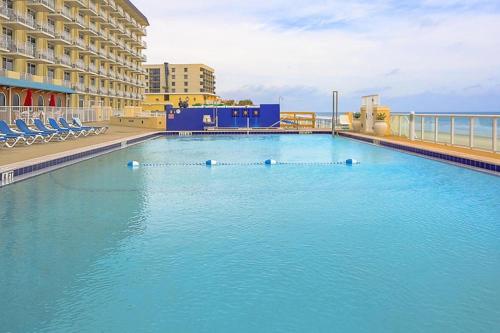 a large swimming pool on top of a building at Tropical 1BD vacation condo in beautiful resort setting with pool amenities to enjoy in Ormond Beach