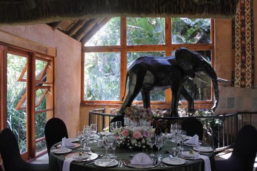 a table with a statue of a horse on top of it at Misty Hills Country Hotel, Conference Centre & Spa in Muldersdrift