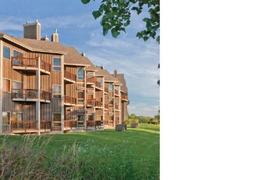a row of apartment buildings on a lawn at Worldmark Galena - 1BD in Galena