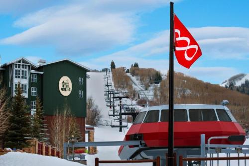 a red van parked next to a ski lift at Marriott Mountainside Luxury 1BD in Park City