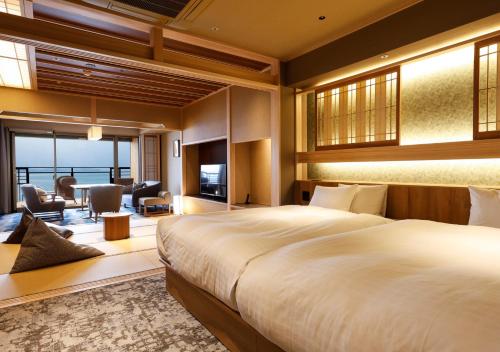 Postel nebo postele na pokoji v ubytování Hotel New Awaji