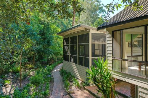 a house with a view of a forest at Valley Hideaway - Whole House in Narrawallee