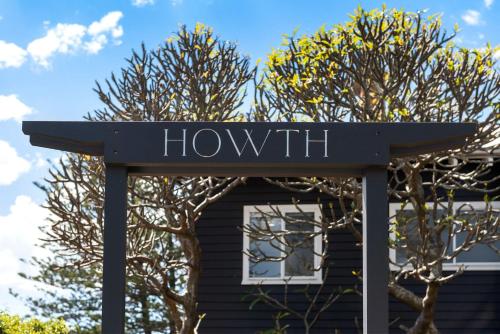 a sign that says howth in front of a house at Howth - The Black House by TCC in Newport