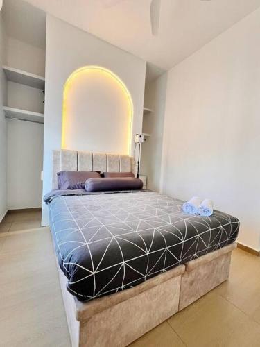 a bedroom with a bed in a room with an arched window at Melur House - Private Pool, Jacuzzi, Bbq, Netflix, PS4 in Malacca
