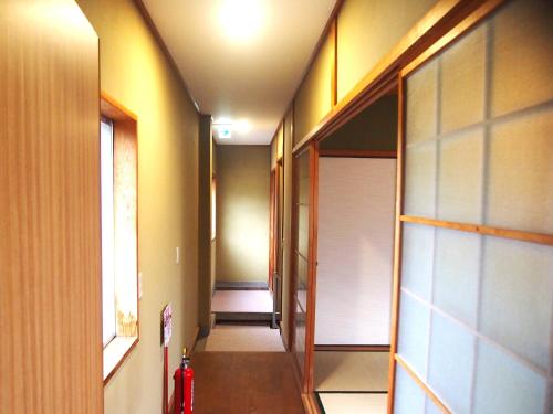 Postel nebo postele na pokoji v ubytování 那智の里 Accommodation along the Kumano Kodo trail