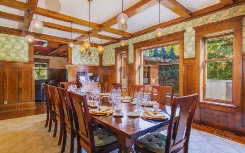 a dining room with a wooden table and chairs at Martha's Bed and Breakfast in Lincoln