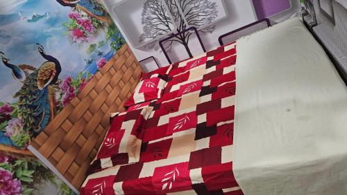 a close up of a quilt hanging on a wall at Vrindavan Nivas -Near Prem mandir bankey bihari in Vrindāvan
