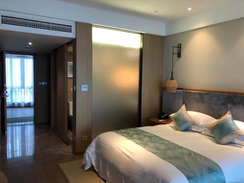 Zhoushan Yibo Hotelにあるベッド