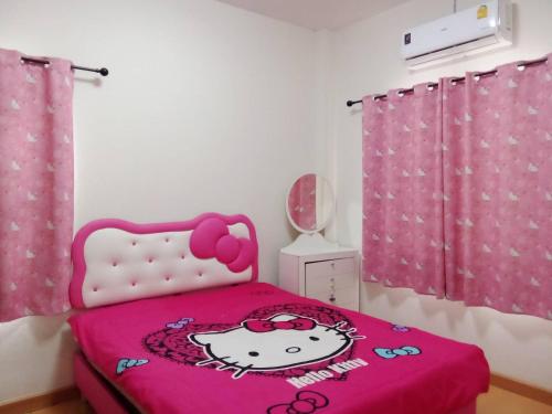 a bedroom with a hello kitty bed with a pink blanket at Chiang Mai Home in Chiang Mai