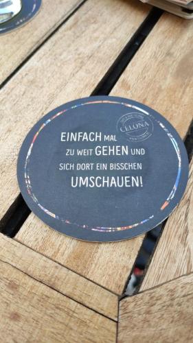 a blue frisbee sitting on top of a wooden table at Luxus Wohnung auf Zeit in Warburg