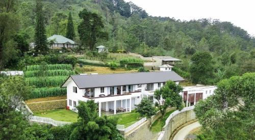 an aerial view of a house in the mountains at Benito Bungalow, Haputale by The Serendipity Collection in Haputale