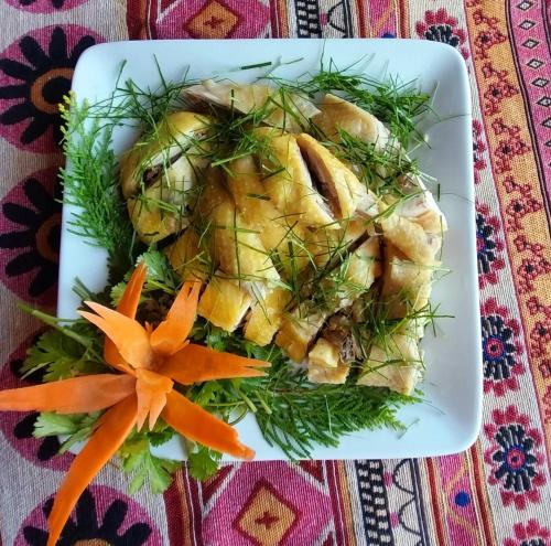 a plate of food with carrots on a table at Nasan Green Farm in Cao Bằng
