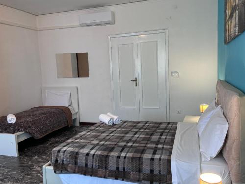 a small room with a bed and a couch in it at Mestre Residence in Mestre