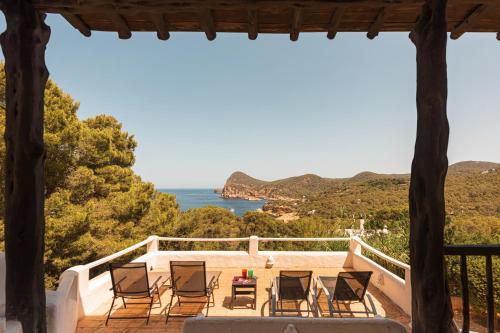 a patio with chairs and a view of the ocean at New! Villa Salada Sea Views in San Antonio