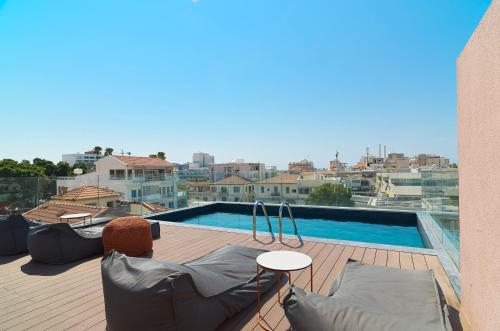 a balcony with a view of a swimming pool at Alinea Market Agora Square in Limassol