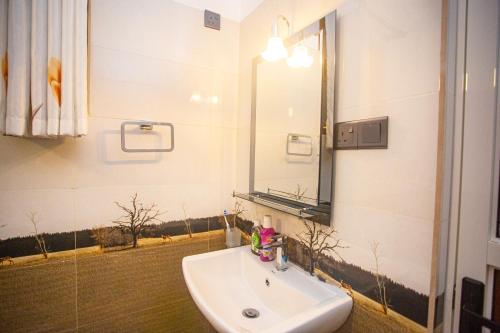 a bathroom with a sink and a mirror at 2BR Family Getaway Hikkaduwa- Sleep 6 - Surfing- Bikes and airport drop-off in Hikkaduwa