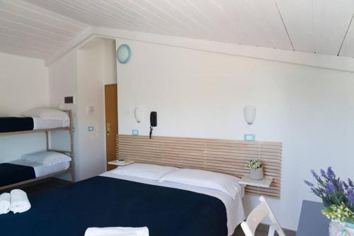 Ένα ή περισσότερα κρεβάτια σε δωμάτιο στο Hotel Jolie