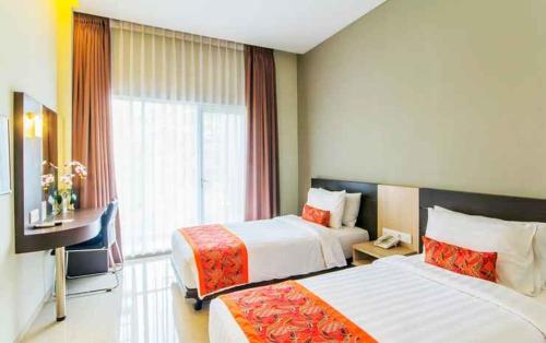 Postel nebo postele na pokoji v ubytování Moscato Hotel