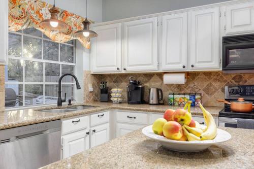 a bowl of fruit on a counter in a kitchen at RARE FIND! Heatd Pool Spa GameRoom Fall Special! in San Antonio