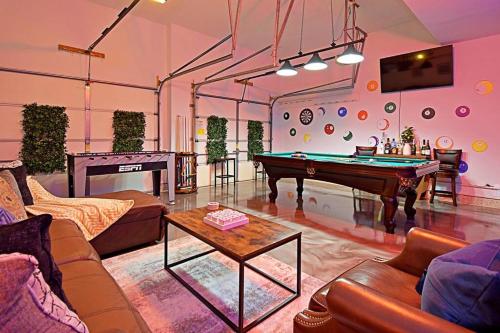 a living room with a pool table in it at RARE FIND! Heatd Pool Spa GameRoom Fall Special! in San Antonio