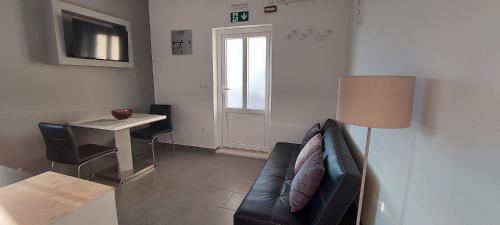 a living room with a couch and a table at Apartment "MANNA in Korčula