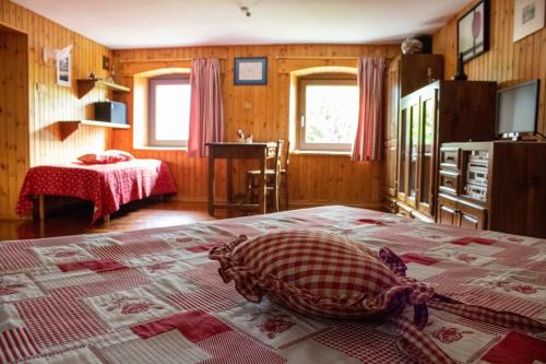 Postel nebo postele na pokoji v ubytování Appartamenti Maison Guyon