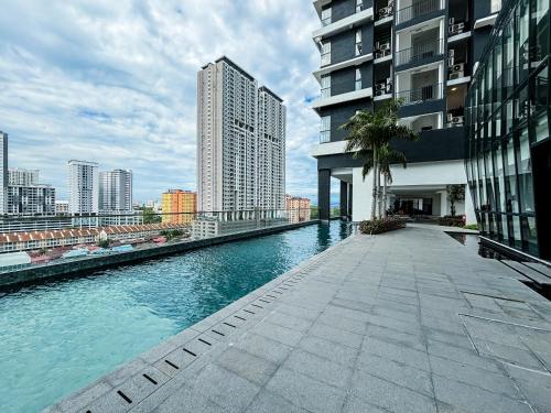 a river in the middle of a city with buildings at Designer Suites 2BR Apartment in Penang near George Town Self Check-In WiFi Partial Seaview in Jelutong