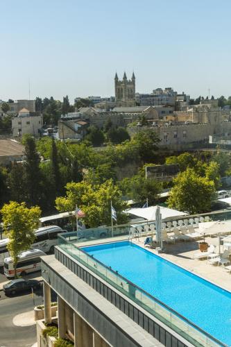 a view of a swimming pool on top of a building at Grand Court Hotel in Jerusalem