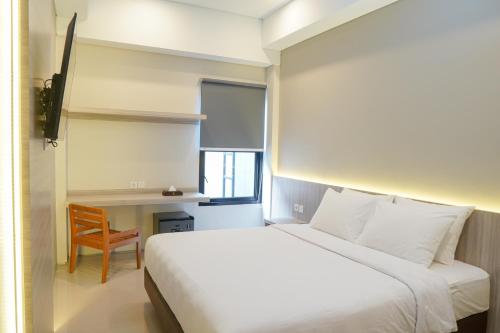 Voodi või voodid majutusasutuse Sajiwa Inn and Suite Hotel toas