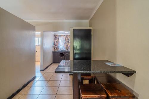 a kitchen with a counter and a counter top at ATKV Goudini Spa in Rawsonville