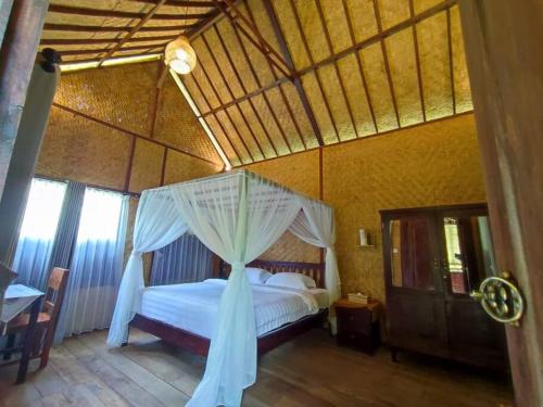 Кровать или кровати в номере JungleHavenBali - Private and Nature Stay