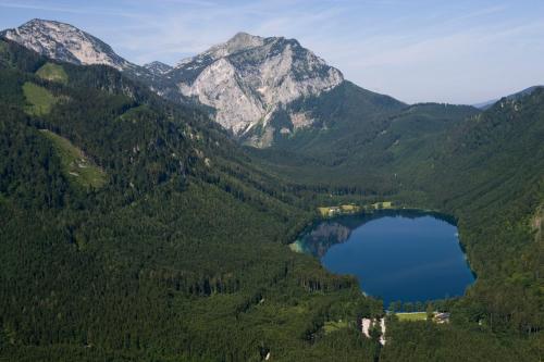 a view of a valley with a lake and mountains at Landhotel Post Ebensee am Traunsee ***S in Ebensee