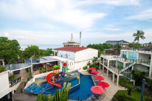 an aerial view of a pool at a resort at FuramaXclusive Ocean Beach Seminyak Bali in Legian