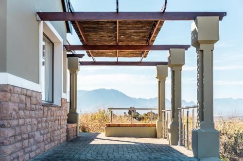 a porch with a view of the mountains at ATKV Goudini Spa in Rawsonville