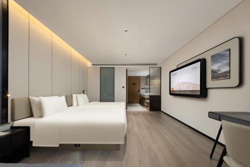 Μια τηλεόραση ή/και κέντρο ψυχαγωγίας στο Atour Hotel Guangzhou Nansha UNI MALL