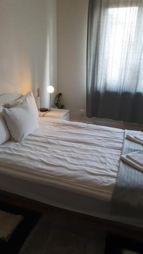 Ένα ή περισσότερα κρεβάτια σε δωμάτιο στο Home