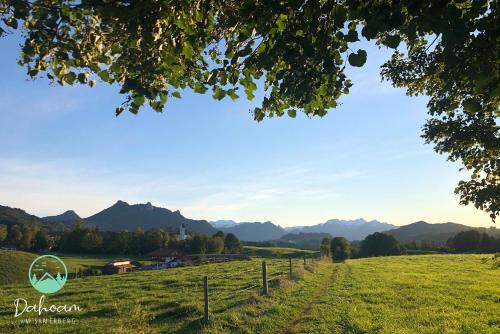 a view of a field with mountains in the background at Dahoam am Samerberg in Samerberg