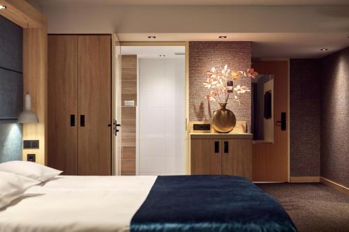 Postel nebo postele na pokoji v ubytování Van der Valk Hotel Leusden - Amersfoort