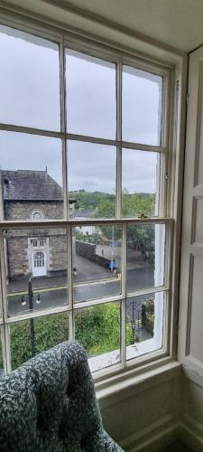 a room with a window with a view of a building at Ivy Guest house in Hawkshead
