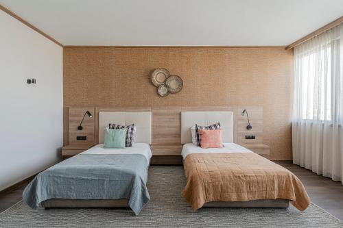 Una cama o camas en una habitación de WN LAB Hotel - including breakfast and parking