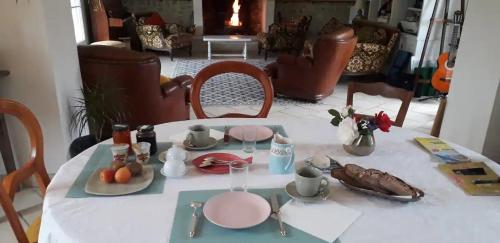 a table with a plate of food on it at La Maison Poésie in Blay
